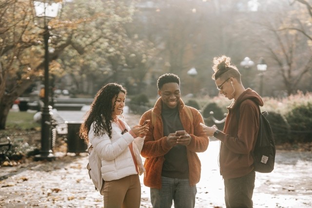 Group of people using mobile phones