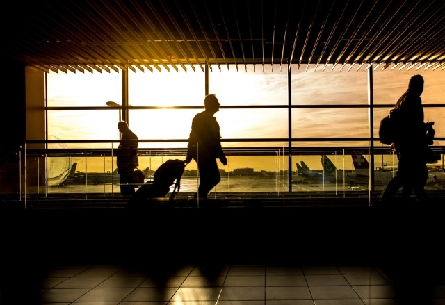 Man walking at airport with luggage